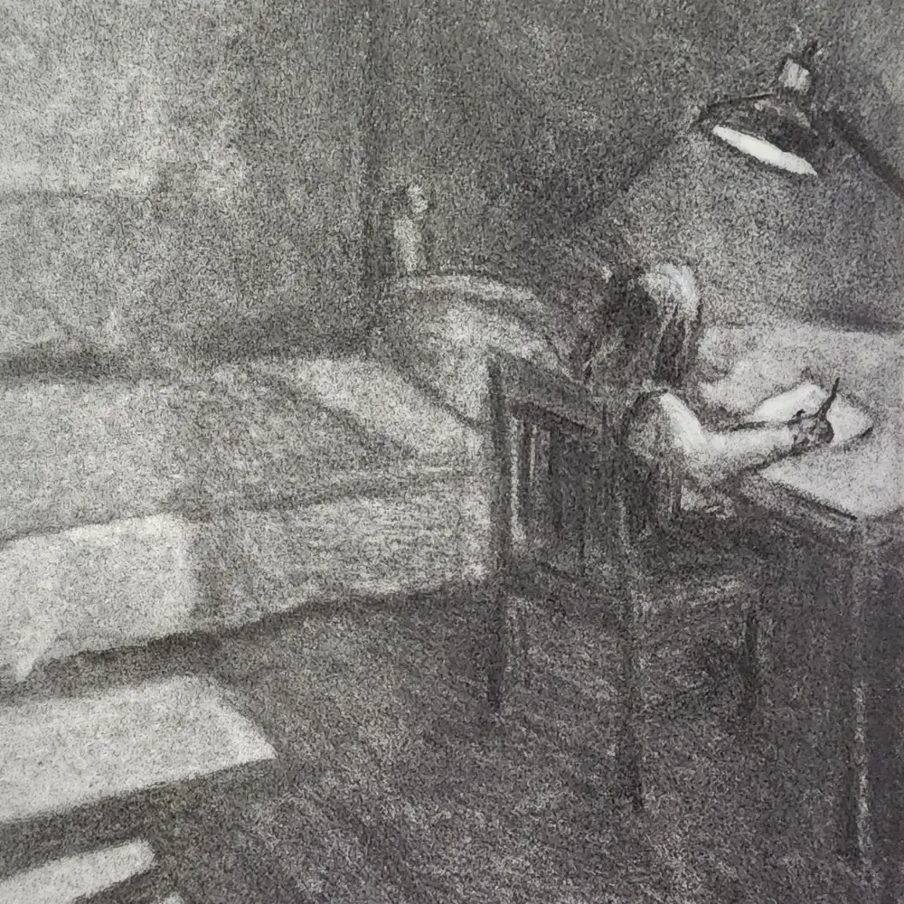 Grayscale image of a person seated at a desk, leaning over papers with a chair in a dim room.